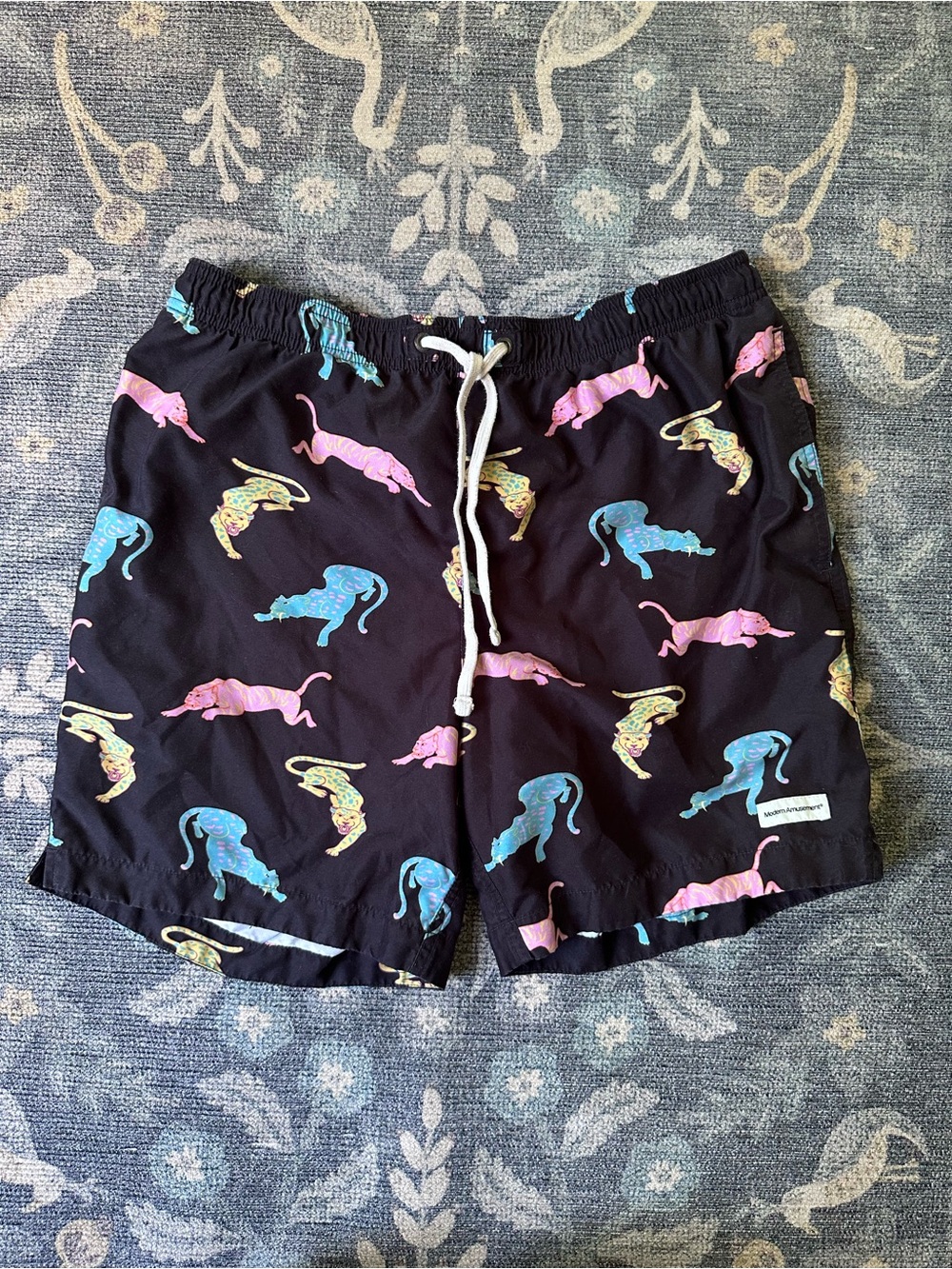 Modern Amusement Black Swim Trunks with Pink, Blue & Yellow Panther Print